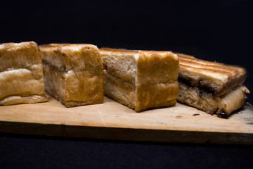 toast with chocolate sprinkles and tea to accompany relaxing time with a black background
