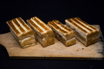 toast with chocolate sprinkles and tea to accompany relaxing time with a black background