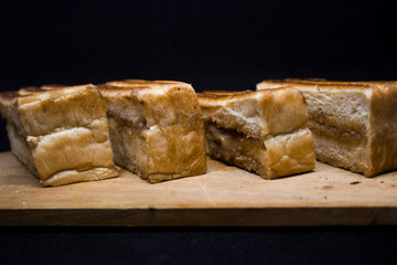 toast with chocolate sprinkles and tea to accompany relaxing time with a black background