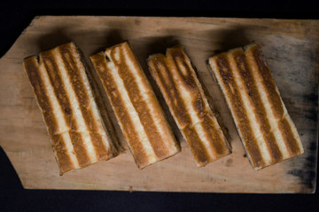 toast with chocolate sprinkles and tea to accompany relaxing time with a black background