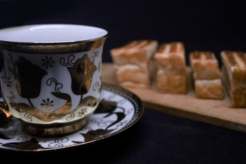 toast with chocolate sprinkles and tea to accompany relaxing time with a black background