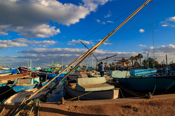 Old fishing boats in the sea harbor of Hurghada, Egypt