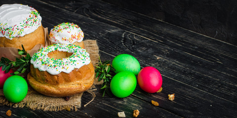 Easter cake and Easter eggs, traditional holiday attributes (Happy Easter!). food background. dark background. top