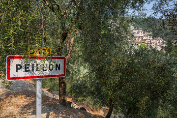 Obraz premium Sign for the beautiful hilltop village of Peillon in the Alpes-Maritime department of southeastern France