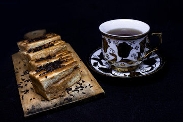 toast with chocolate sprinkles and tea to accompany relaxing time with a black background