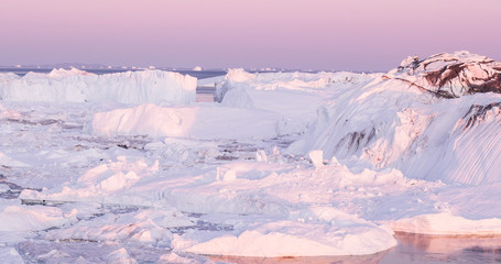 Fototapeta na wymiar Global Warming and Climate Change - Icebergs from melting glacier on Greenland