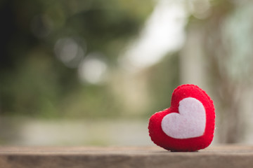 White and red heart shape on paper notebook on green, background.love concept for valentine's day.