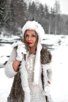 Winter photos of beautiful blue-eyed girl .