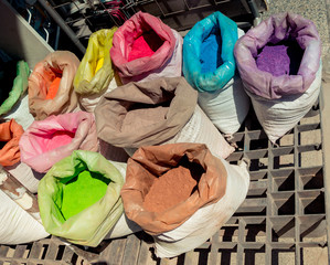 Sacks with paint pigment in different colors