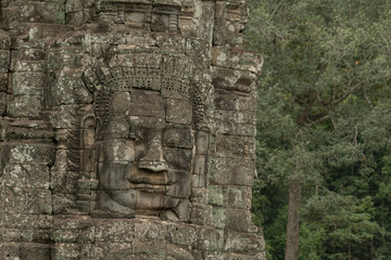 Fototapeta na wymiar Frieze of Buddha face on Bayon wall