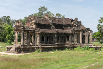 Fototapeta na wymiar Ruined Angkor Wat stone temple in jungle