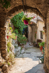 The stunning narrow cobblestone streets of the beautiful hilltop village of Peillon in the...
