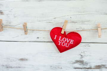 Red hearts on wooden background on Valentine's Day.