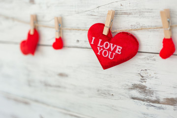 Red hearts on wooden background on Valentine's Day.