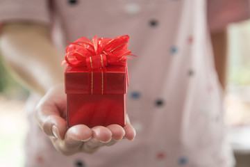Valentine gift,Woman hand holding a gift box