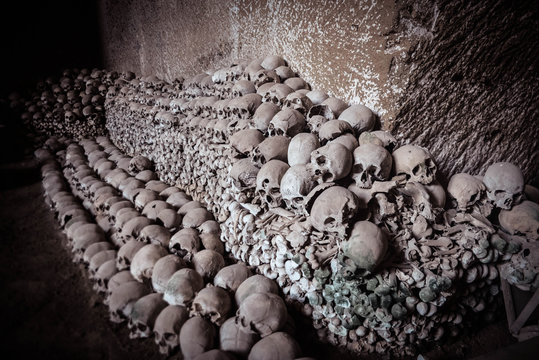 Cemetery With A Collection Of Stacked Human Skulls