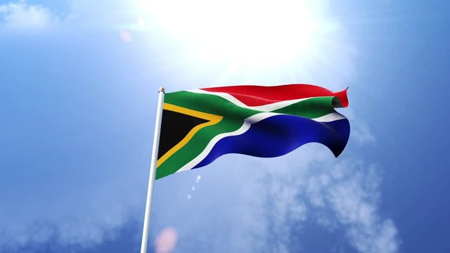 The national flag of South Africa waving in the wind on a sunny day.  Beautiful slow motion shot of the South African flag.