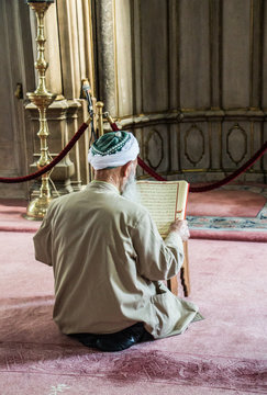 Old Man Reading Quran In A Mosque