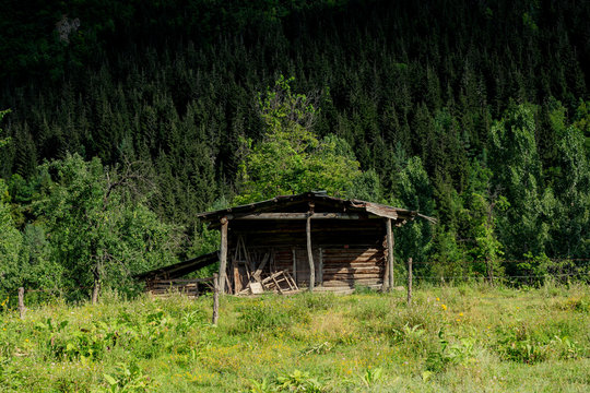 Small wooden bay harn on beautiful green background