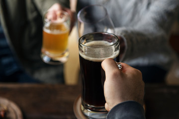 People cheering with glasses of beer