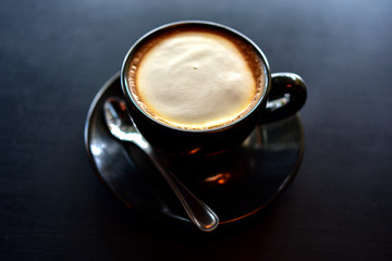 Coffee in a black cup