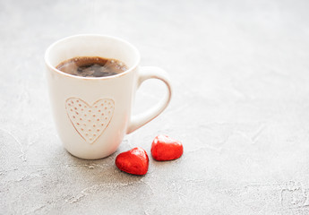 Cup of coffee and chocolate candy