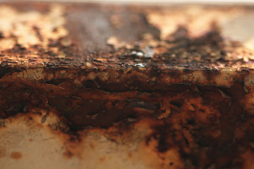Close up zoom shot of grunge metal rust on old cube steel pipe.