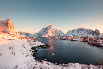 Sunrise on snowy in Reine village on winter at Lofoten islands