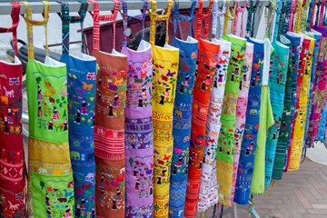 colorful aprons for sale at the market