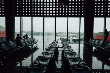 Rows of empty chairs in an airport