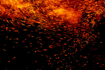 flame of fire with sparks black background