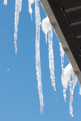 Obraz na płótnie Canvas ice icicles on the roof