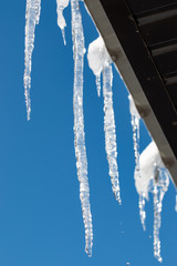Obraz na płótnie Canvas ice icicles on the roof