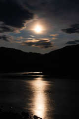 moon over river in mountain