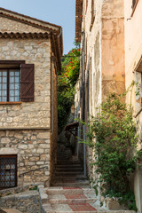 Fototapeta na wymiar Narrow stairway in Peille, a beautiful medieval village in southeastern France