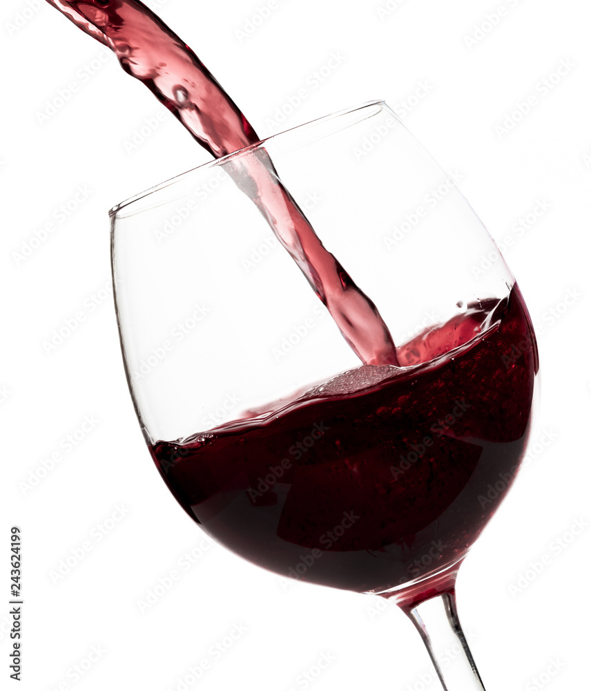 Wall mural beautiful splash of red wine in a glass on white background.