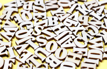 Wooden letters of the English alphabet close-up, background, education concept