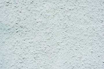 Background of a blue stucco coated and painted exterior, rough cast of cement and concrete wall texture