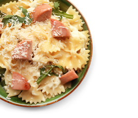 Delicious pasta with sausage in bowl on white background