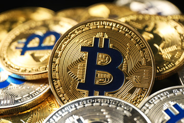 Golden and silver bitcoins, closeup