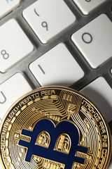 Bitcoin on PC keyboard, closeup