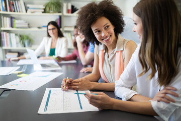 Creative business people working on business project in office