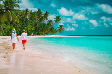 happy loving couple walk on beach vacation