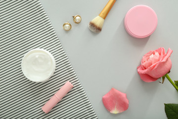Composition with cosmetics on light background