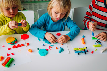 kids play with clay molding shapes, learning through play