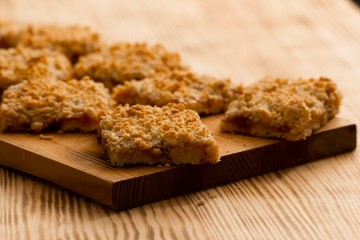 homemade apple pie on wooden background close up with copy space
