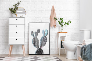 Modern interior of restroom with ceramic toilet bowl