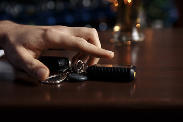 Do not drink and drive! Cropped image of drunk man talking car keys