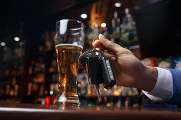 Do not drink and drive Cropped image of drunk man talking car keys
