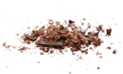 Cinnamon sticks with powder and shavings, macro isolated on white background